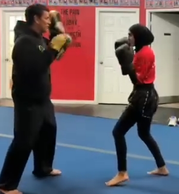 A Glory Muay Thai student training with Kru Denis